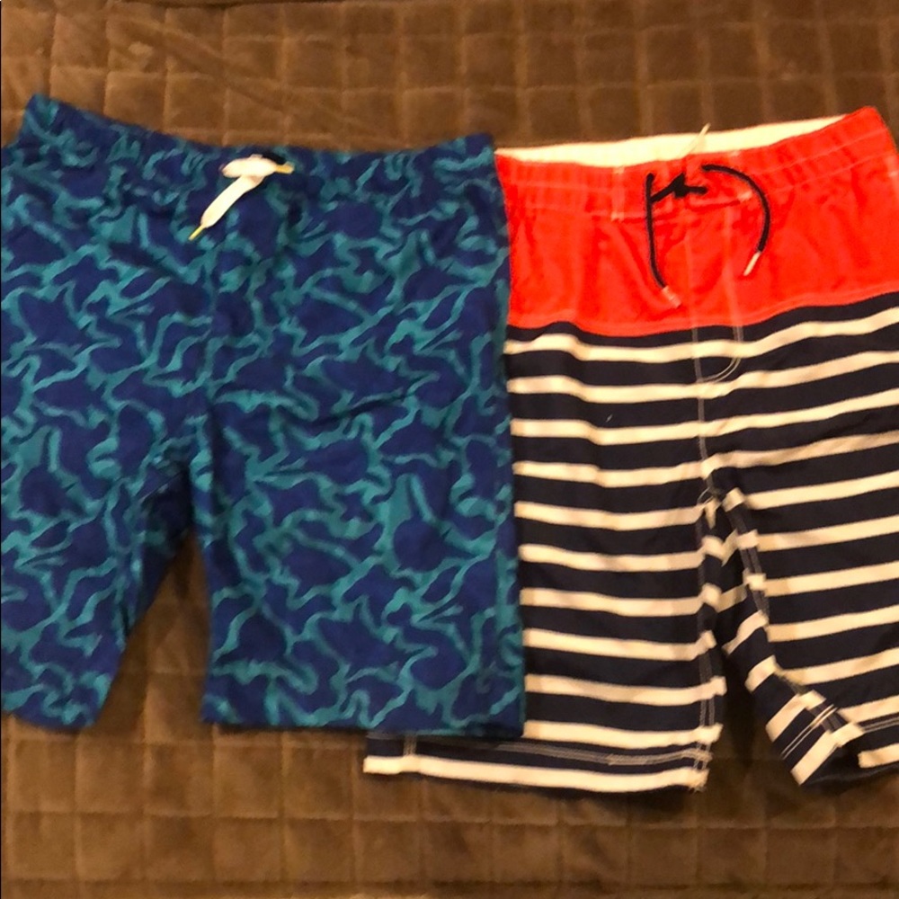 Two pairs of boys swim trunks.